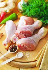 Image showing Raw chicken on wooden board, Chicken with spice