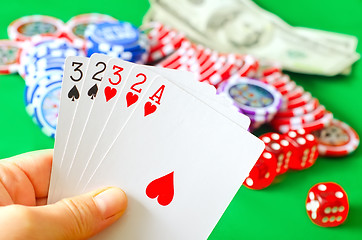 Image showing Card for poker in the hand, chips and card for poker