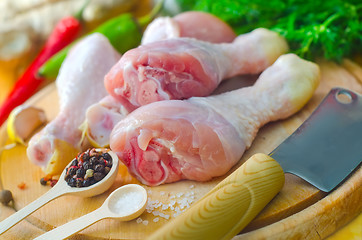 Image showing Raw chicken on wooden board, Chicken with spice