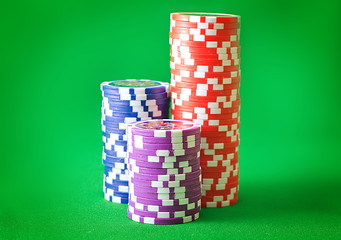 Image showing Group from chips for poker on the green background