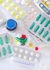 Image showing color pills and medical bottle