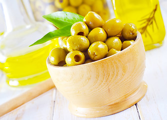 Image showing green olives and oil