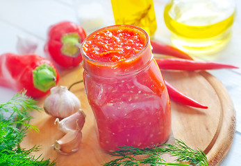 Image showing Fresh chilli sauce in the glass bank