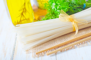 Image showing raw rice noodles and raw salmon