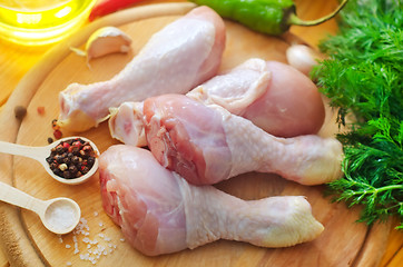 Image showing Raw chicken on wooden board, Chicken with spice