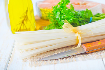 Image showing raw rice noodles and raw salmon