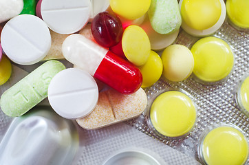 Image showing color pills and tablet, the medical means