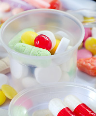 Image showing color pills and tablet, the medical means