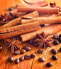 Image showing cinnamon, anis and coffee beans on wooden background