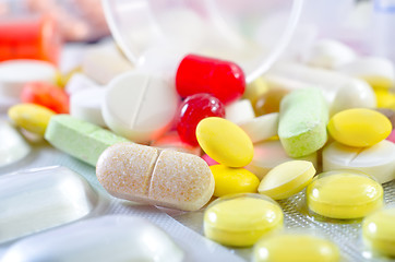 Image showing color pills and tablet, the medical means