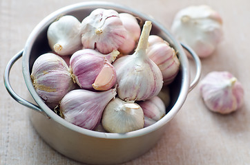 Image showing garlic in metal bowl on the table