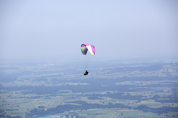 Image showing Paragliders flying over Bavarian mountains