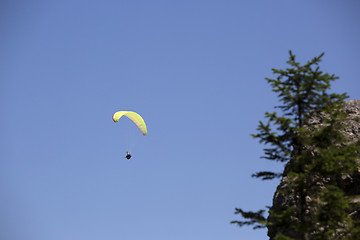 Image showing Paraglider flying over Bavarian mountains