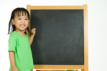 Image showing Chinese little girl with blank blackboard