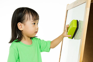 Image showing Chinese little girl writing on whiteboard