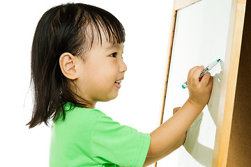 Image showing Chinese little girl writing on whiteboard