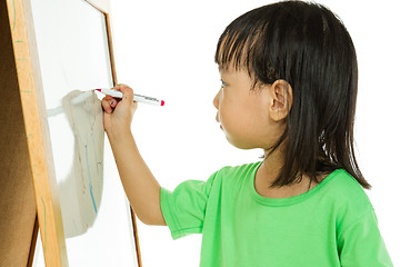 Image showing Chinese little girl writing on whiteboard