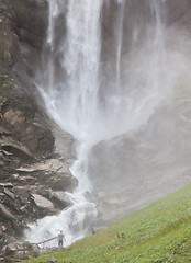 Image showing Hiker, young man with large waterfall