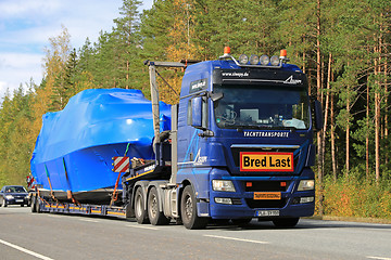 Image showing MAN Truck Hauls a Boat as Exceptional Load