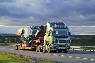 Image showing Scania 164 V8 Truck Hauls Terex Pregon Crusher