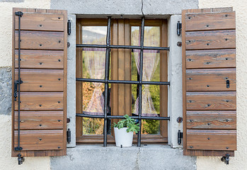 Image showing window with open wooden shutters 