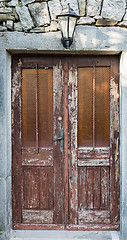 Image showing old brown yellow ragged shabby wooden door