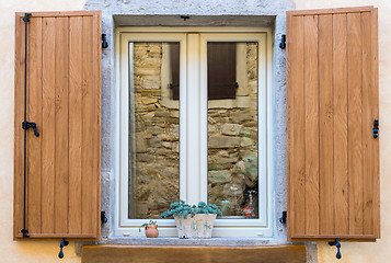 Image showing window with open wooden shutters