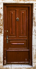 Image showing brown ragged shabby wooden door