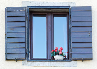 Image showing window with open wooden shutters 