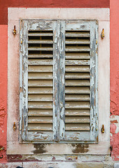 Image showing old window with  closed shutters