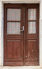 Image showing old brown yellow ragged shabby wooden door