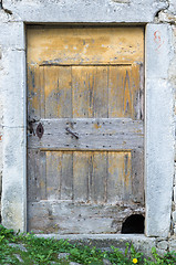 Image showing old ragged shabby wooden door