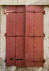 Image showing old window with  closed wooden shutters