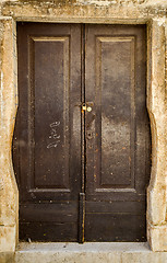 Image showing old brown yellow ragged shabby wooden door