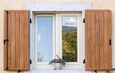 Image showing window with open wooden shutters