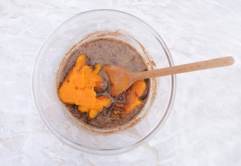 Image showing Stirring pureed pumpkin into pie filling