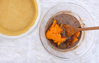 Image showing Pastry case with bowl of pie filling and pureed pumpkin