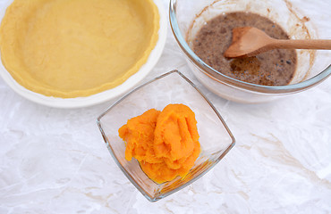 Image showing Pie shell with pureed pumpkin and pie filling