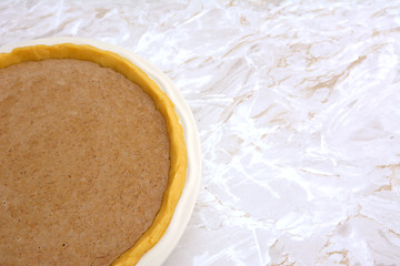 Image showing Pie shell filled with pumpkin pie filling