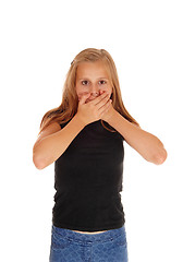 Image showing Young girl holding hands over mouth.