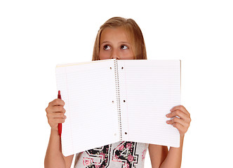 Image showing Girl holding folder for face.