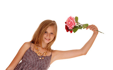 Image showing Lovely girl holding up two roses.