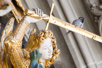 Image showing Berner Muenster, sparrow sitting on a sword