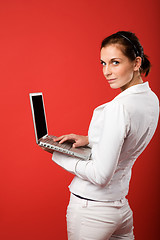 Image showing Female with Computer on Red