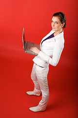 Image showing Female with Computer on Red