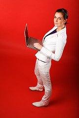 Image showing Female with Computer on Red