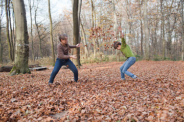 Image showing Kids enjoying at forest in autumn