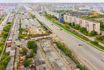 Image showing Aerial view on city street, houses and garages