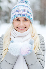 Image showing smiling young woman in winter forest