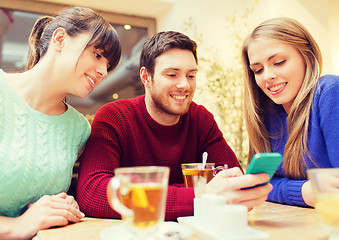 Image showing group of friends with smartphone meeting at cafe